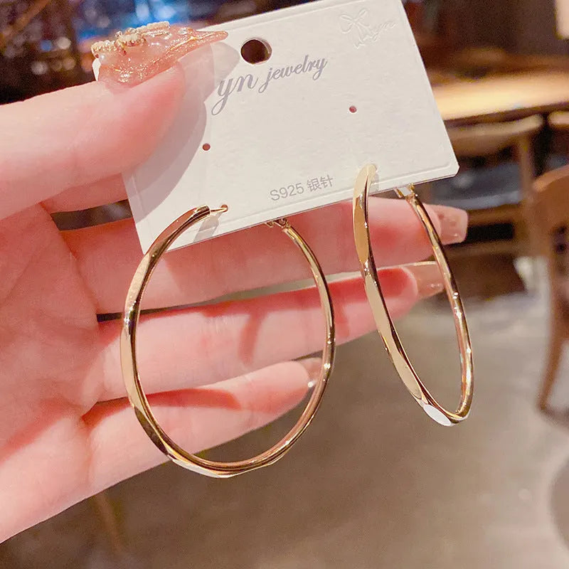 Silver needle exaggerated big hoop earrings in golden big circle with real gold plating on copper base