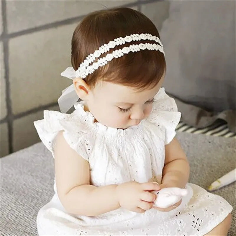 Baby girls headband with double bow-knot and lace floral design in soft cloth material