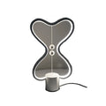 7-colour balance LED night light with magnetic suspension, USB powered, on a desk showing warm white glow