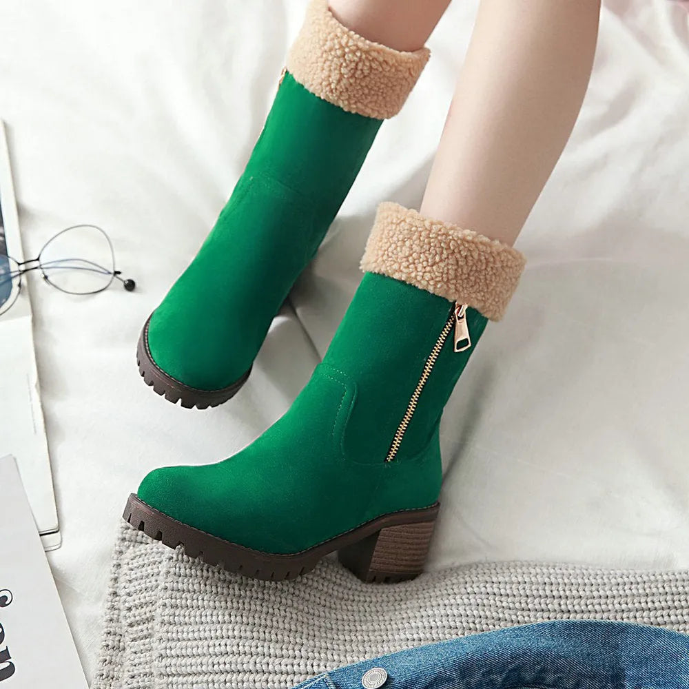 A pair of snow boots in black, grey, green, or orange with a rubber sole and plush lining.