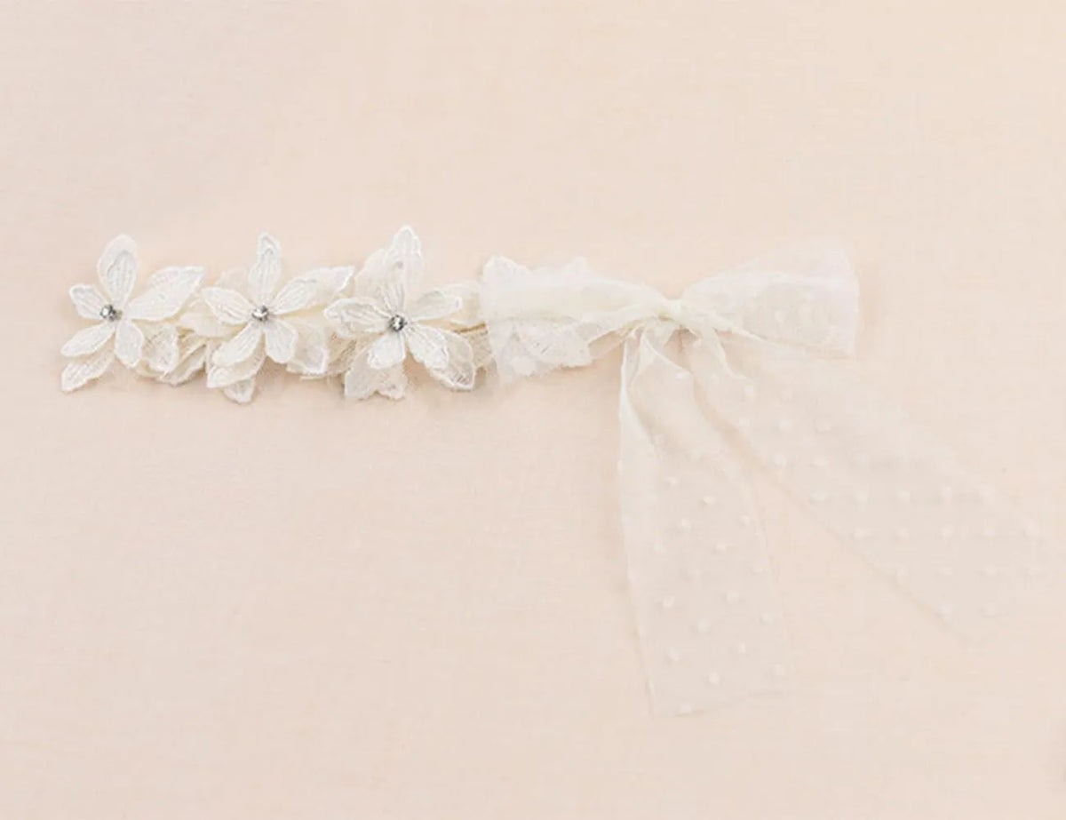 Baby girls headband with double bow-knot and lace floral design in soft cloth material
