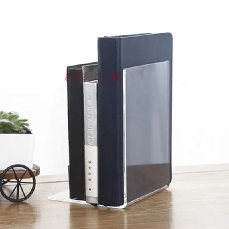 Transparent acrylic bookshelf holding two books on a desk surface