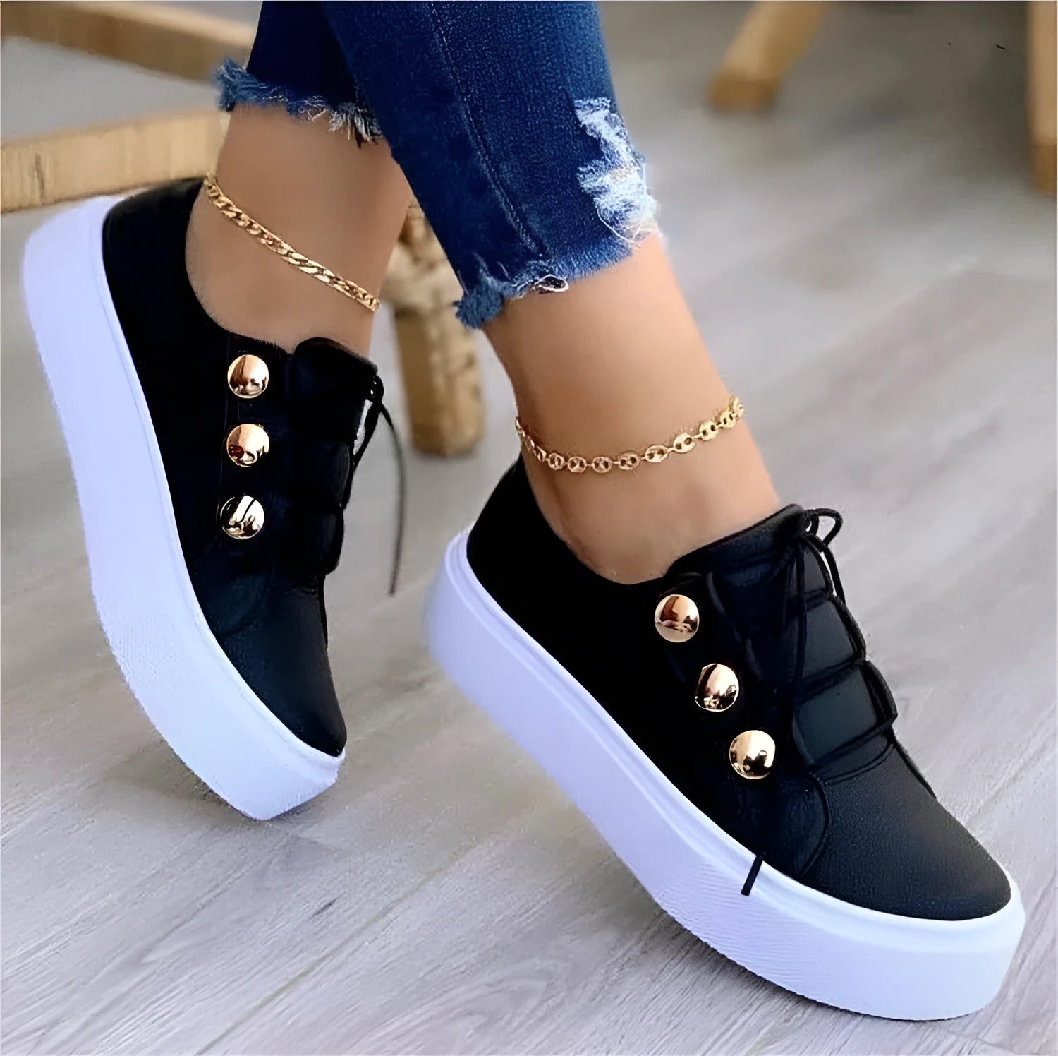 Women's white lace-up flats sneakers with round toe and silver rivet details on the low upper.