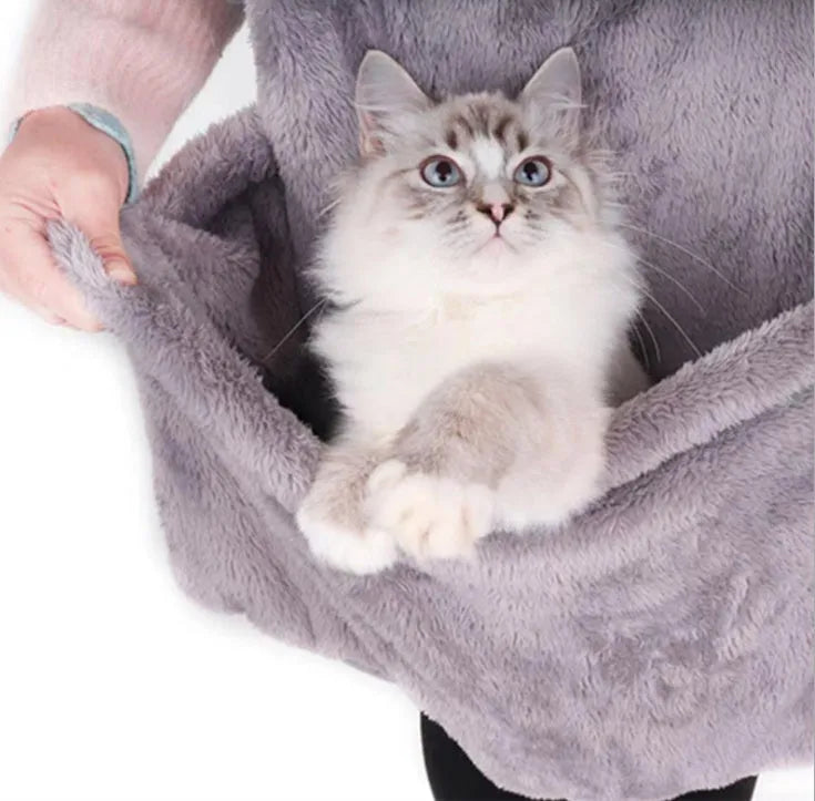 Grey pet out cat carrying bag with sleeping chest apron on a neutral background