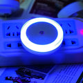 Round halo LED induction nightlight in blue, red, white, and yellow for market stalls.