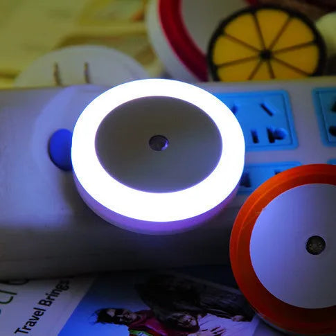 Round halo LED induction nightlight in blue, red, white, and yellow for market stalls.