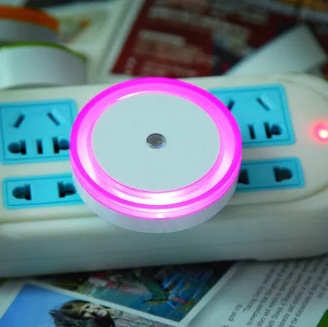 Round halo LED induction nightlight in blue, red, white, and yellow for market stalls.