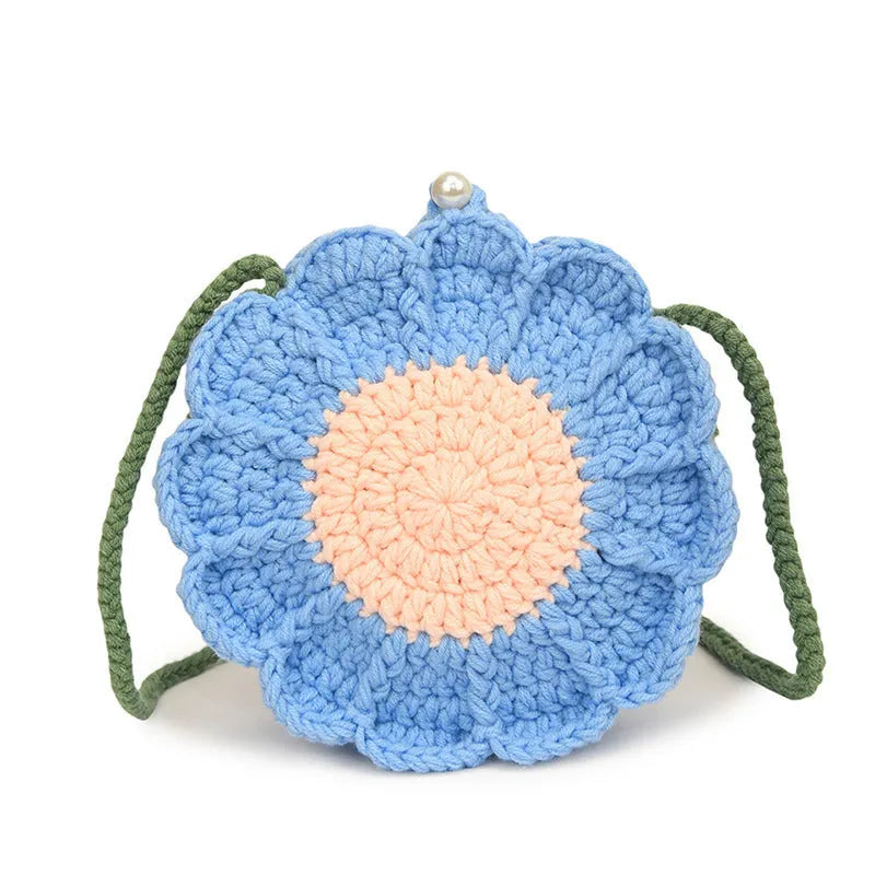 Hand-woven bag with crocheted wool flowers and mobile phone compartment in round suitcase shape