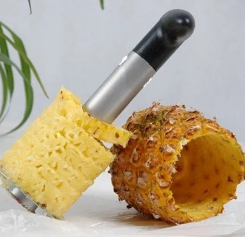 Stainless steel pineapple corer slicer with ABS handle on a kitchen worktop