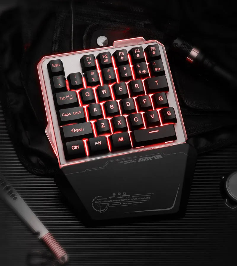 Black robotic one-handed keyboard with RGB backlit keys and a USB cable.