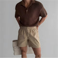 Cotton loose fit sports shorts in black, white, and khaki colours for summer athletic wear
