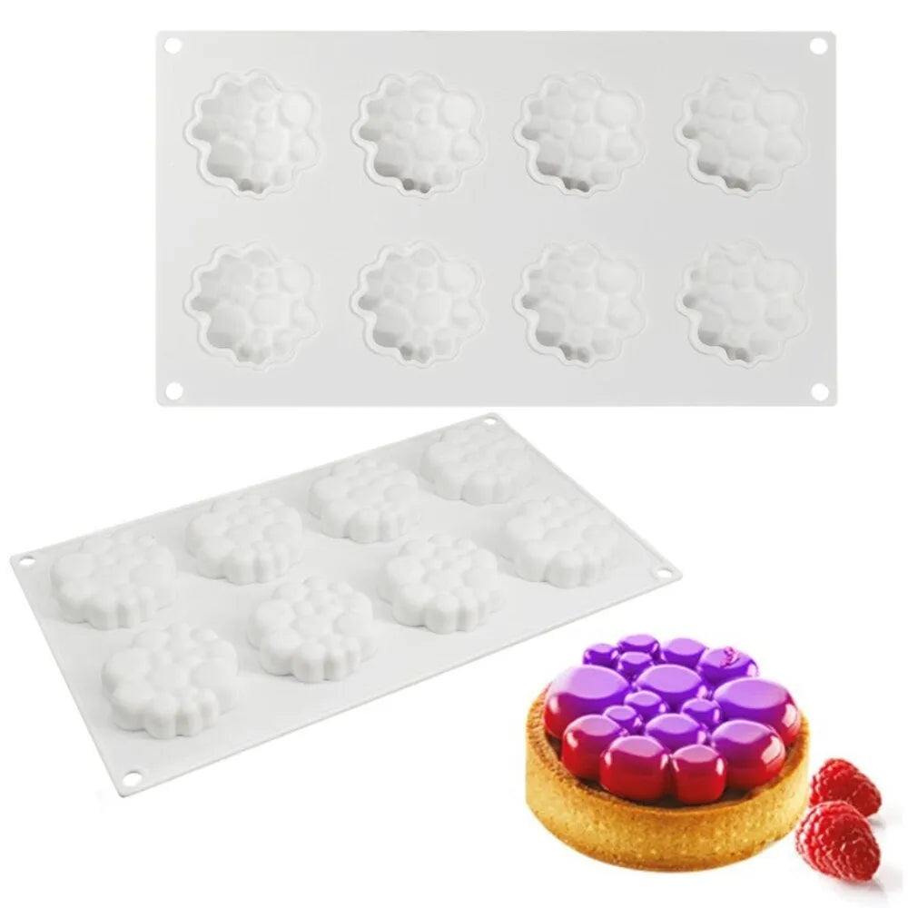 Round silicone cake mould with 8 raised bubble towers for tiered desserts.