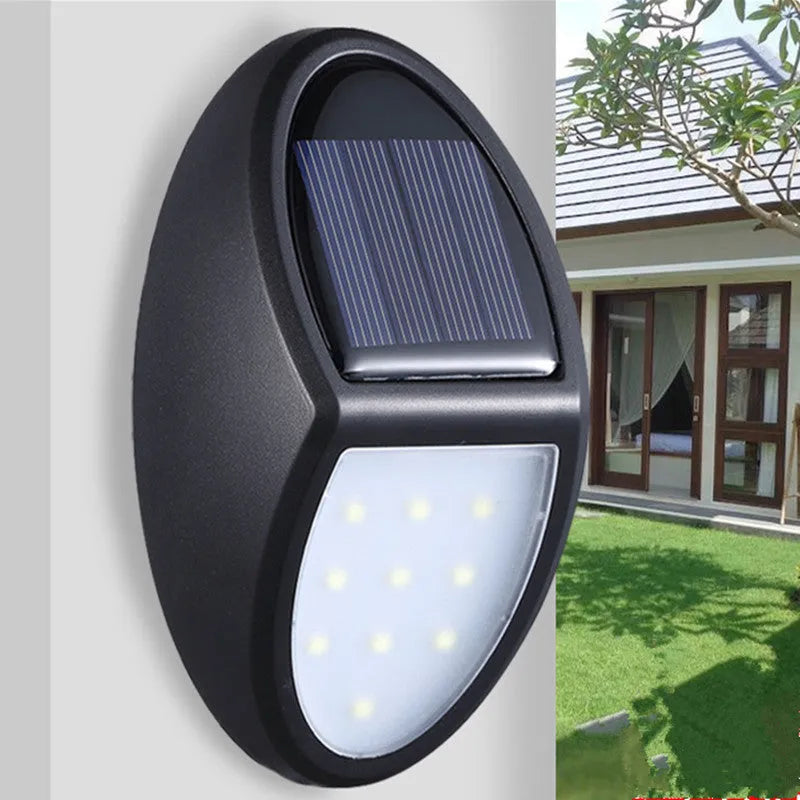 Black rectangular LED solar wall light with integrated solar panel on top