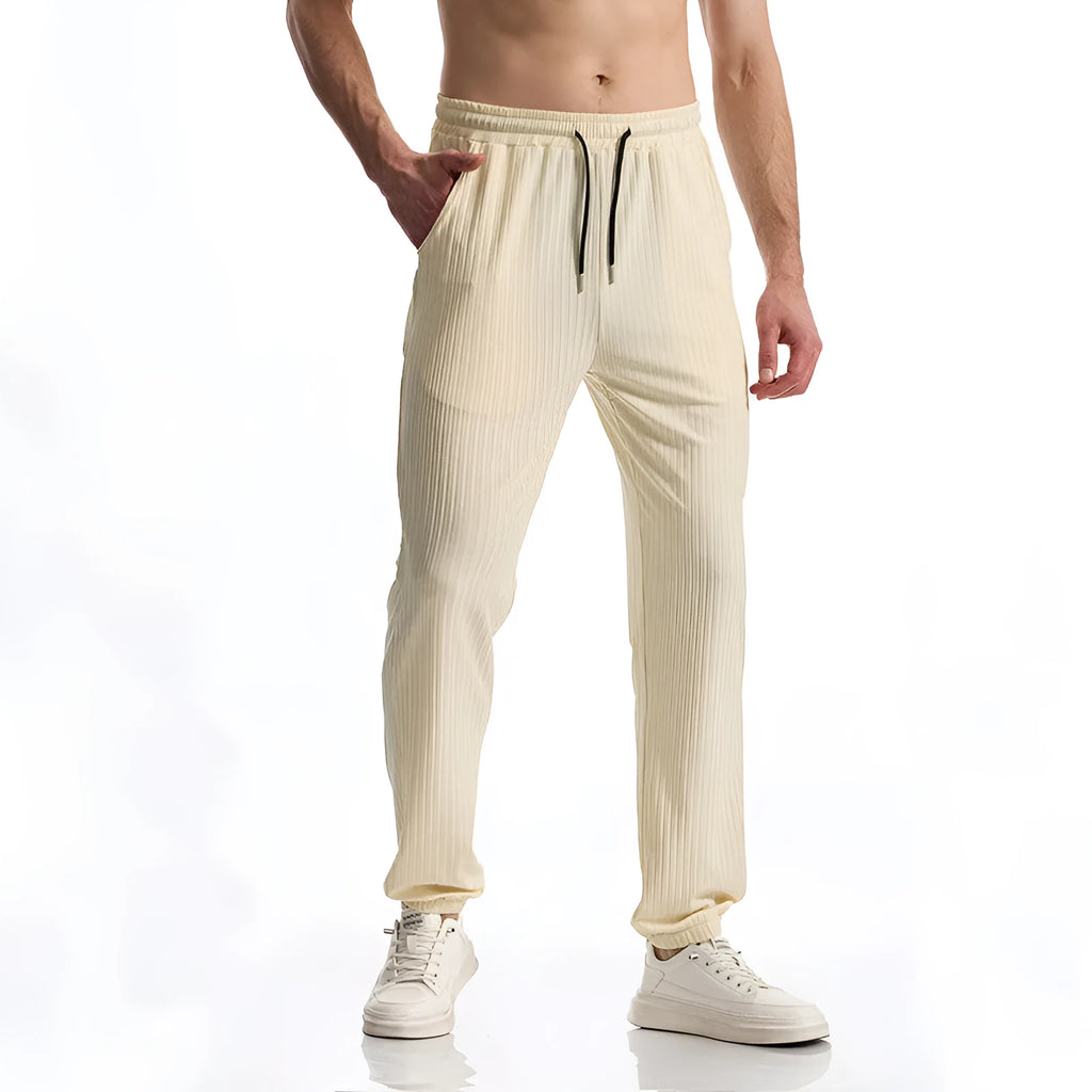 Men's black silky rib fabric casual trousers with baggy straight leg and elastic waistband