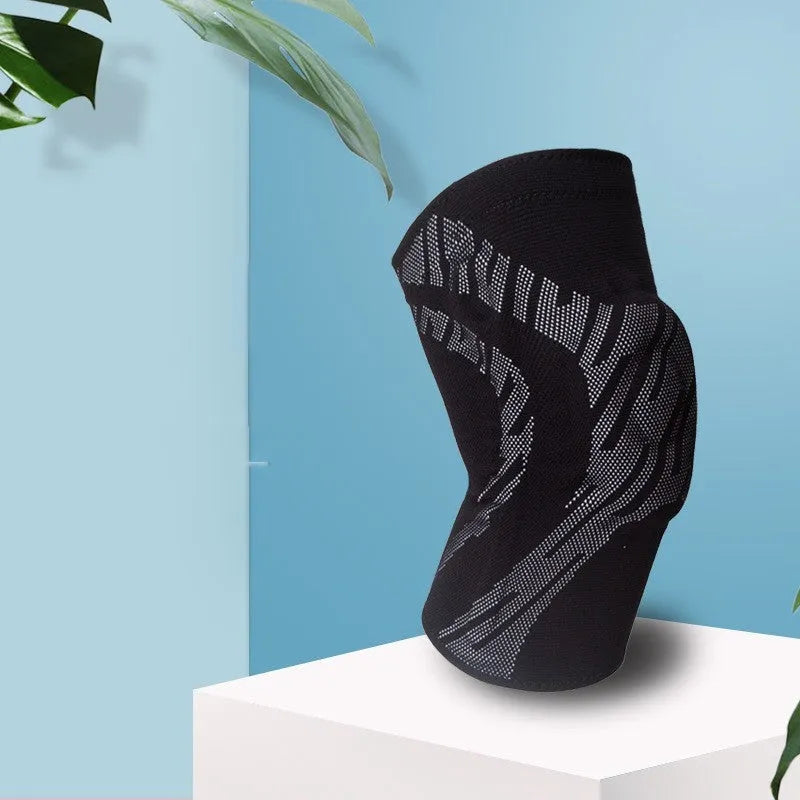 Men's black nylon basketball knee pad shown on a leg, sized for sport.