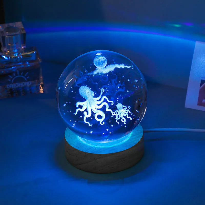 Colorful luminous crystal ball on light wooden base with data cable