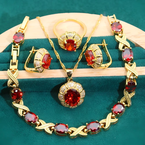 18k gold plated jewellery set showing ring, earrings, bracelet, and necklace with coloured cubic zirconia stones