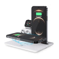 White desktop wireless charging station for phone, smartwatch and headphones showing compact design.