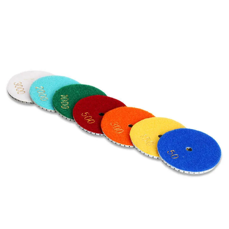 Set of 10 stone polishing pads with diamond emery abrasive, ranging from 50 to 3000 grit.