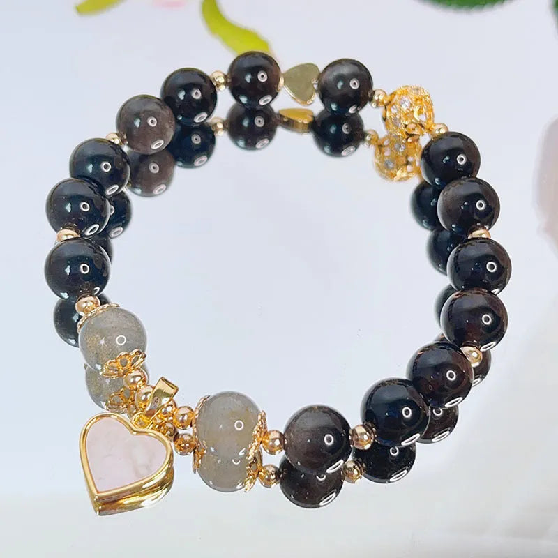 Women's silverstone charm bracelet with electroplated finish showing floral, heart, and star design options