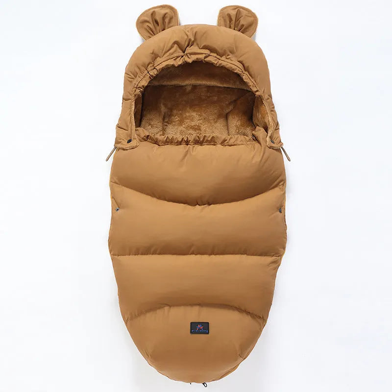 Convertible baby sleeping bag cocoon in a pram, showing cotton blend fabric and flannel lining.