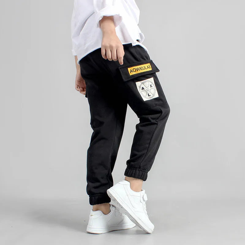 Boys' cotton track pants in black, available in sizes 120cm to 160cm for ages 5-14