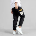 Boys' cotton track pants in black, available in sizes 120cm to 160cm for ages 5-14