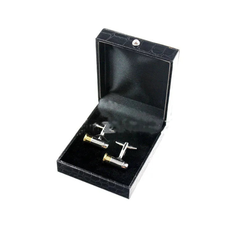 Silver geometric men's cufflinks with copper body and mechanical watch movement on dress shirt cuff