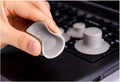 Four grey plastic laptop cooling pads, two large and two small, on a flat surface.