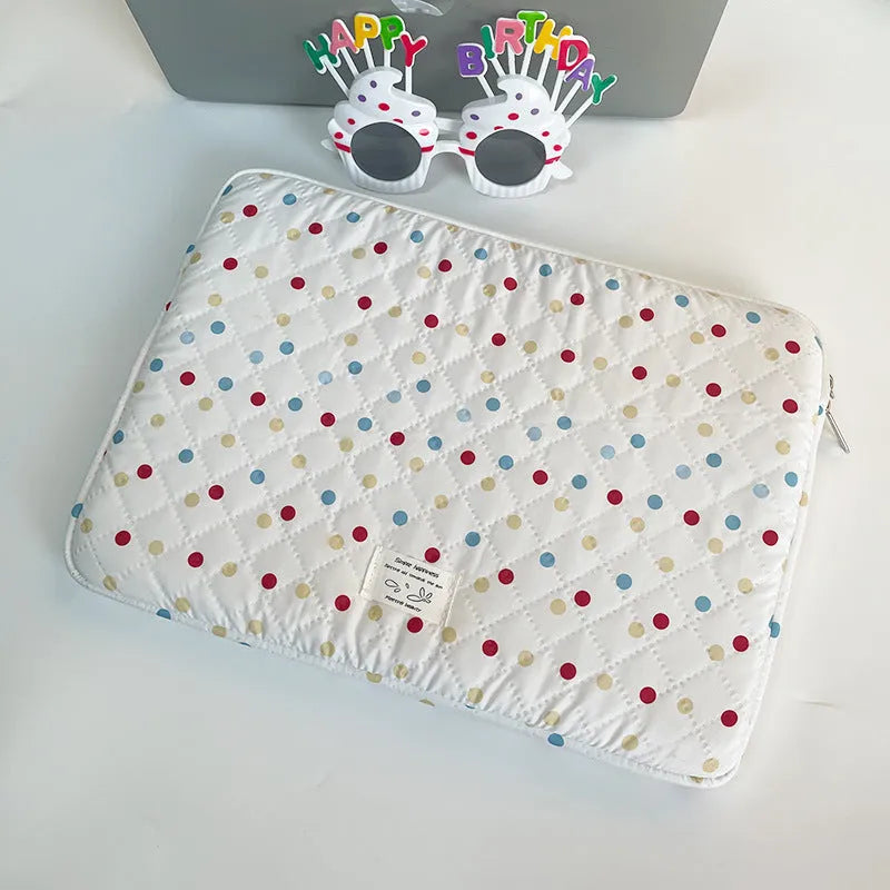 Women's polka dot polyester laptop bag showing front view with storage compartments