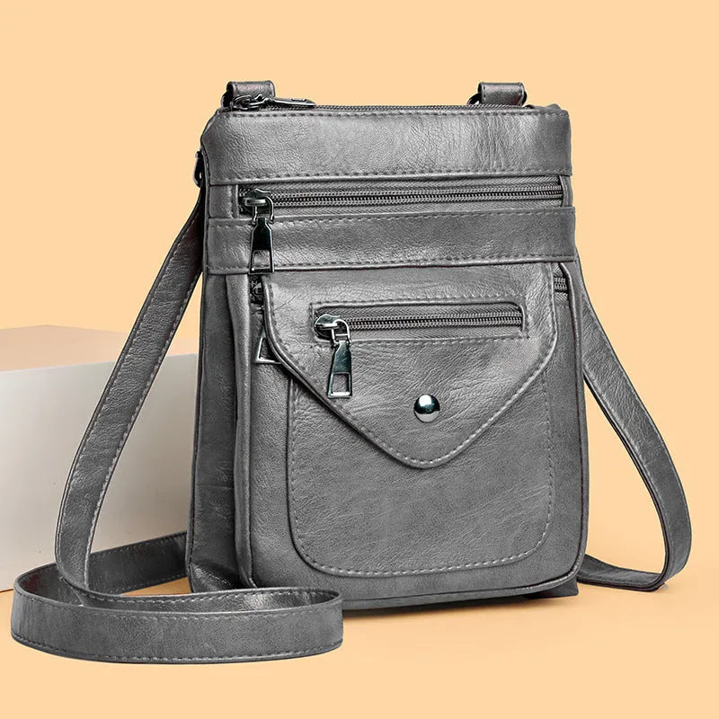 Vertical square crossbody phone shoulder bag in PU with sewing line detail, shown in available colours.