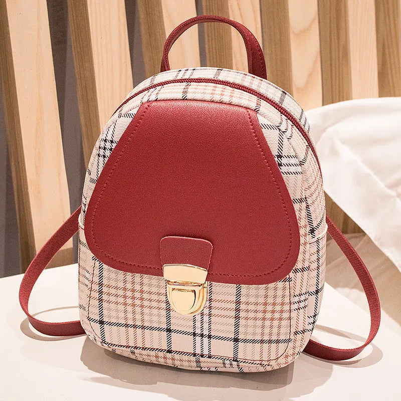 A diagonal one shoulder phone bag in synthetic PU leather, shown in a colour selection.