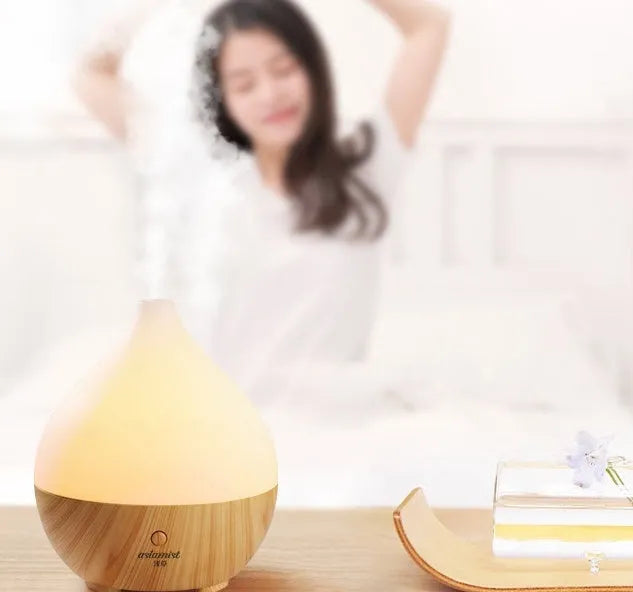 Asakusa wood grain finish vase-shaped aroma diffuser with USB cable on a wooden surface.