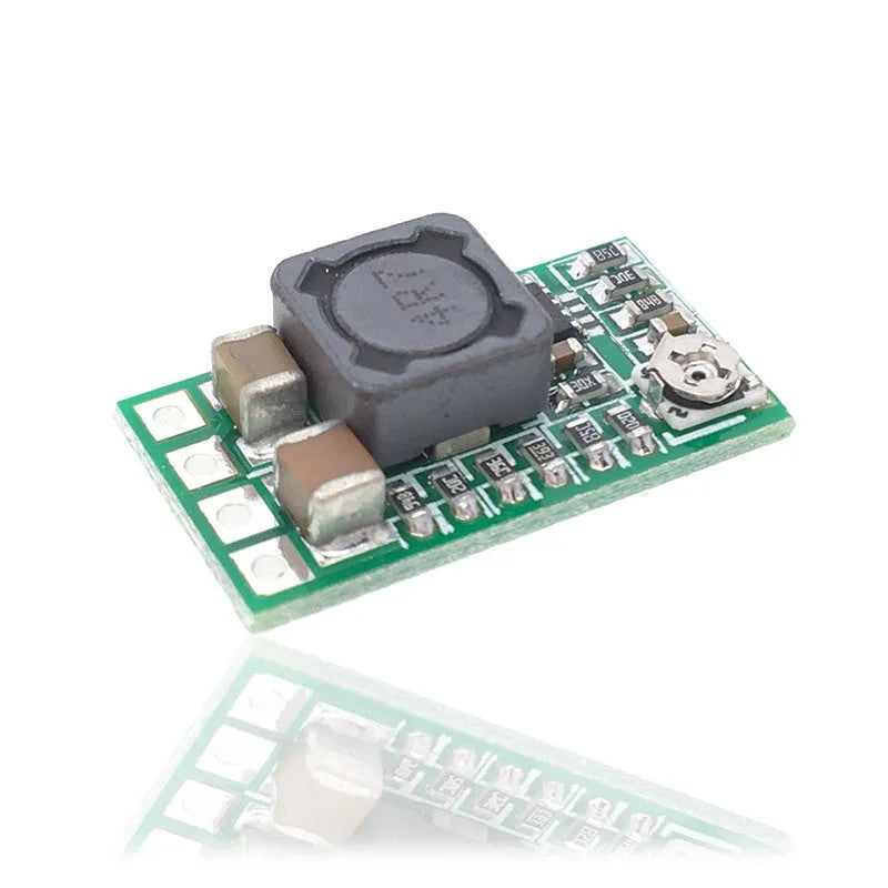 Green mini DC-DC step down power module converting 12-24V to 5V 3A output.