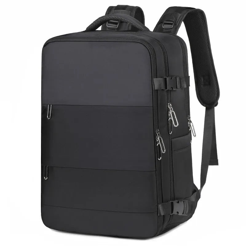 Large grey travel backpack for women with multiple compartments, shown open.