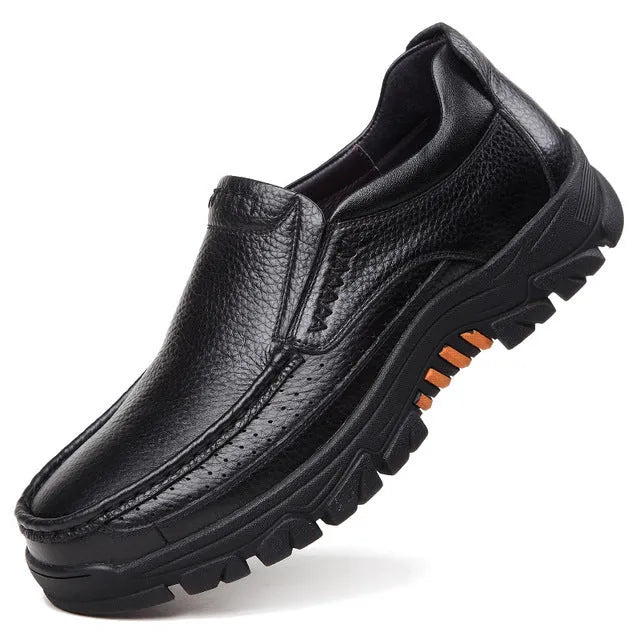 Men's black and brown business casual slip-on shoes made from cowhide leather with rubber soles.