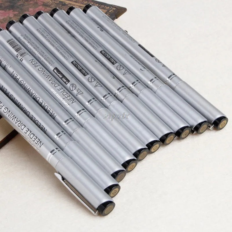 10-pen set of micron needle drawing pens with black pigment ink and assorted colours, showing tip sizes 005 to 20
