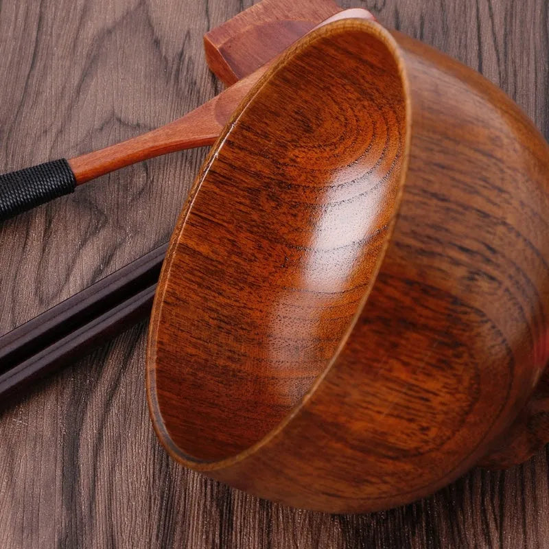 Set of four round wooden bowls in natural wood colour from 10x6.5cm to 11.8x6.7cm