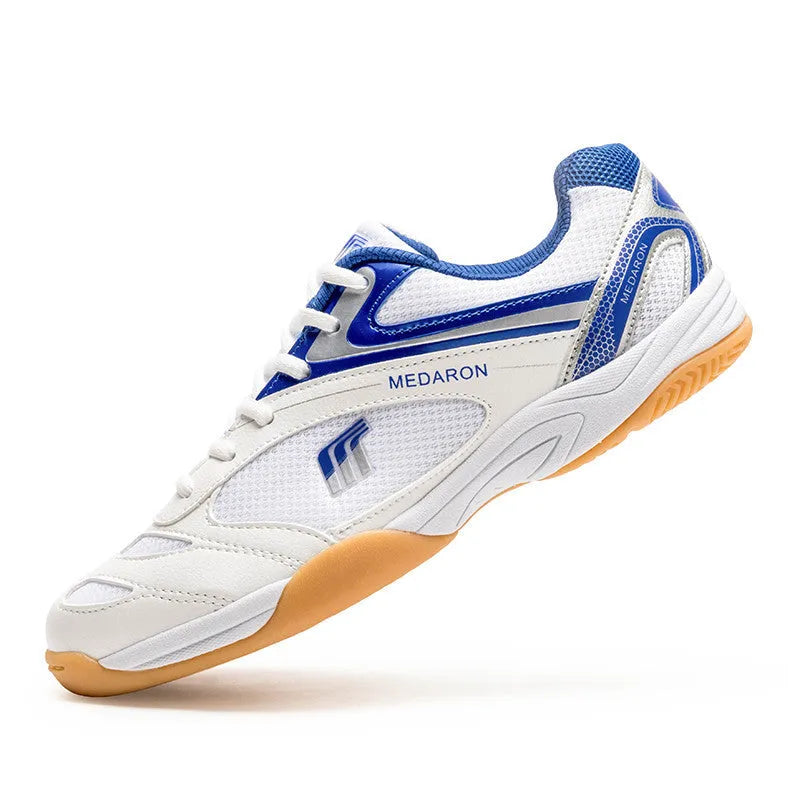 White and blue unisex table tennis training sneaker with lace-up front and rubber sole.