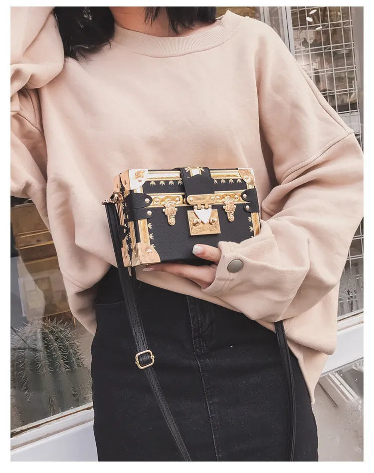 Women's hard-sided black PU leather flap shoulder bag with rivet decoration and hasp closure