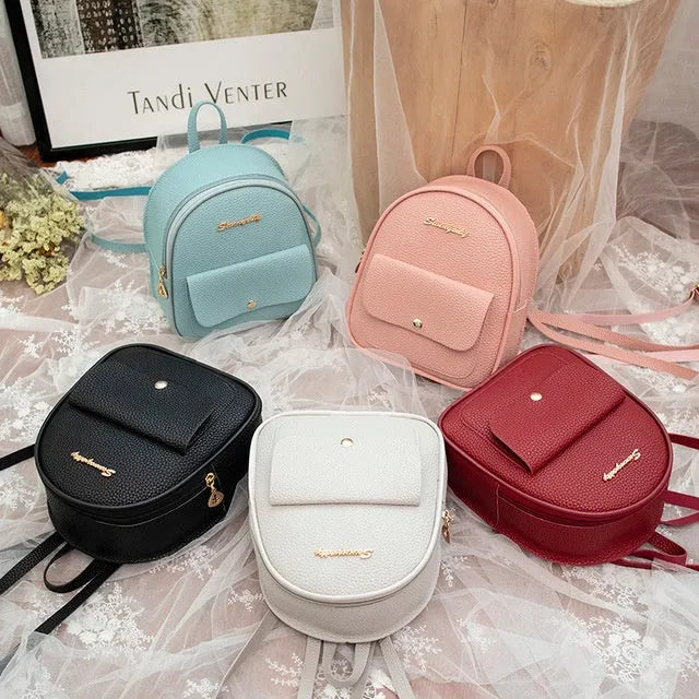 Women's small black PU shoulder backpack with a letter purse and zipper closure.