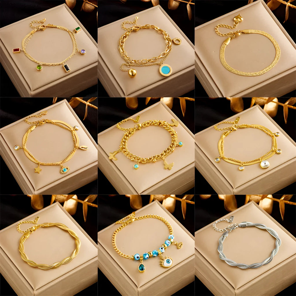 Gold plated titanium steel double layer snake chain bracelet with five-pointed star detail on display