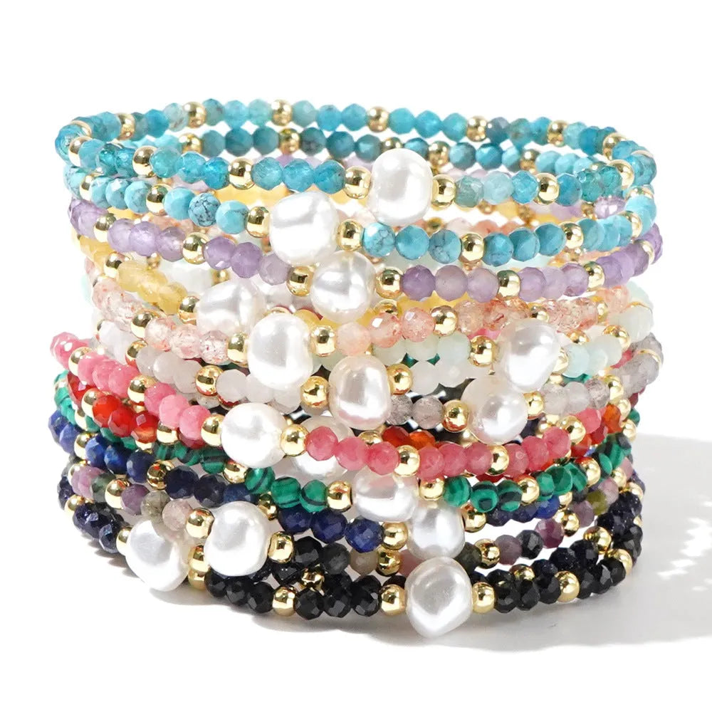 Close-up of a unisex natural stone bracelet with geometric ellipse beads on a wrist.