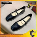 Women's retro black sheepskin Mary Jane flat shoes with a round toe and ankle strap on a rubber sole.