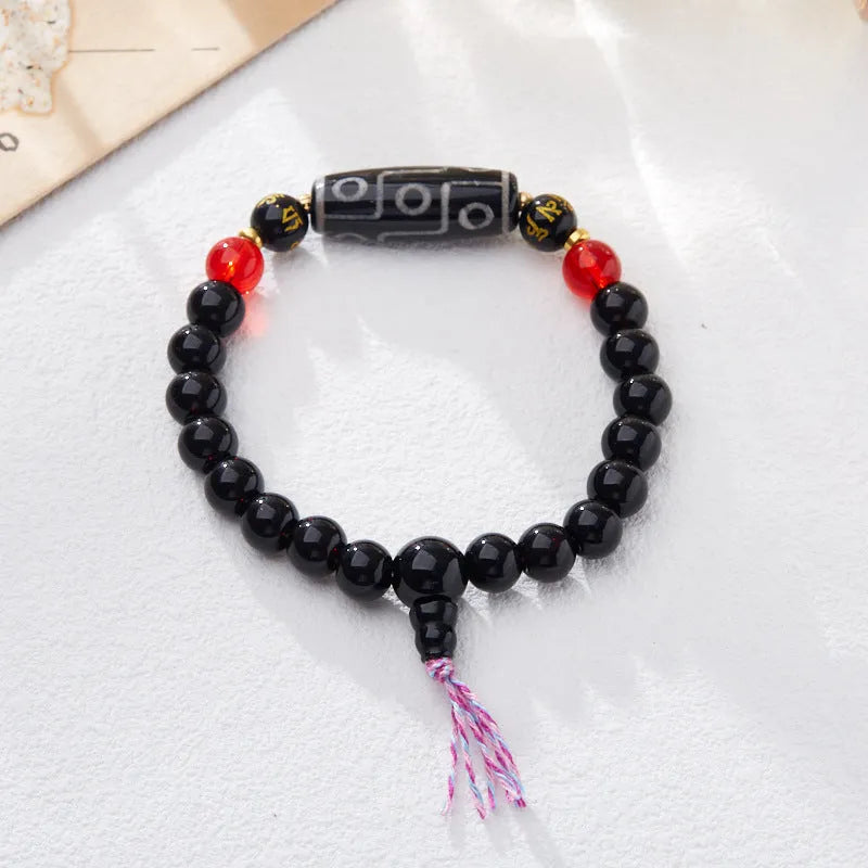 Handmade agate Dzi bead bracelet with 8mm beads in a Tibetan ethnic style.