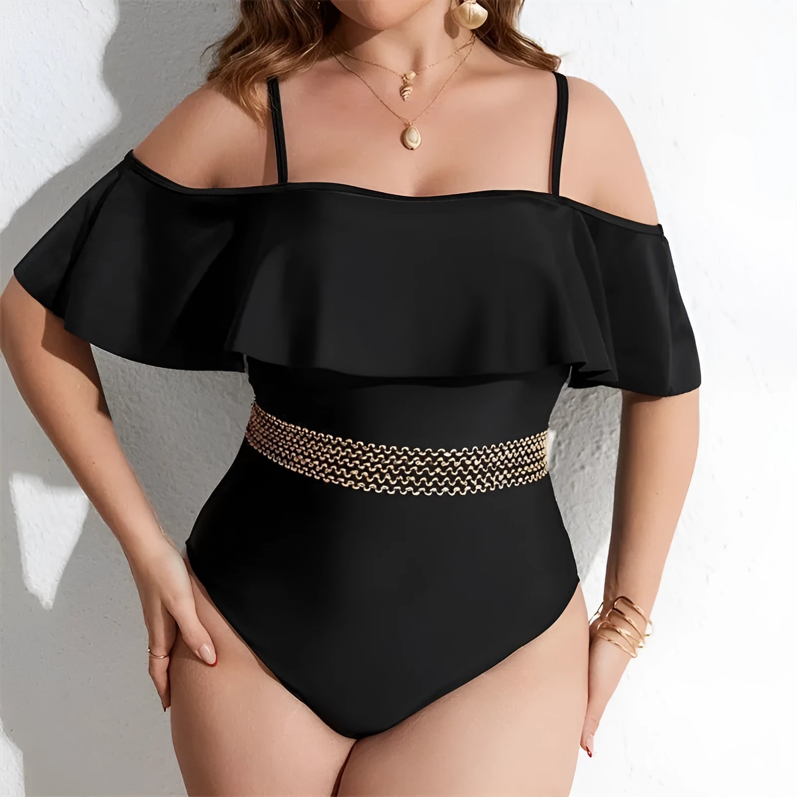 Women's solid black one-piece polyester swimsuit on a hanger