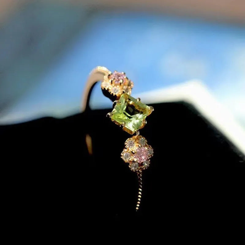 Women's copper ring with geometric flower design in Q740 gold colour, shown on a hand, available in sizes No 6 to No 10