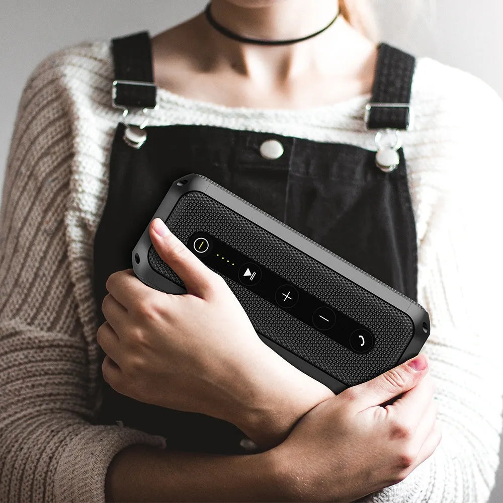 Black plastic portable Bluetooth speaker with subwoofer and 4000mAh battery for outdoor and home use