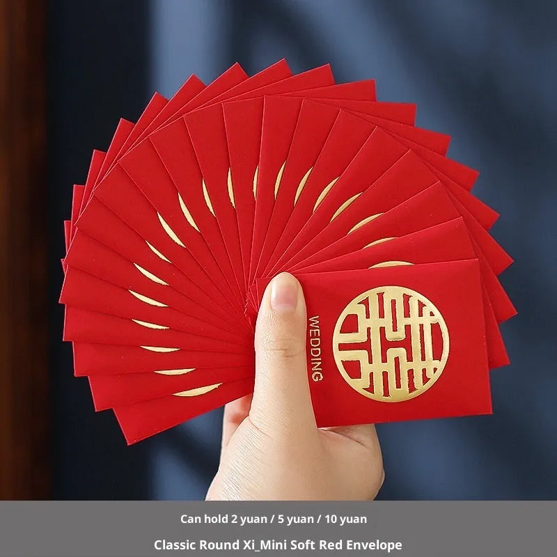 Pack of mini Chinese style wedding red packets in various colours for small cash gifts