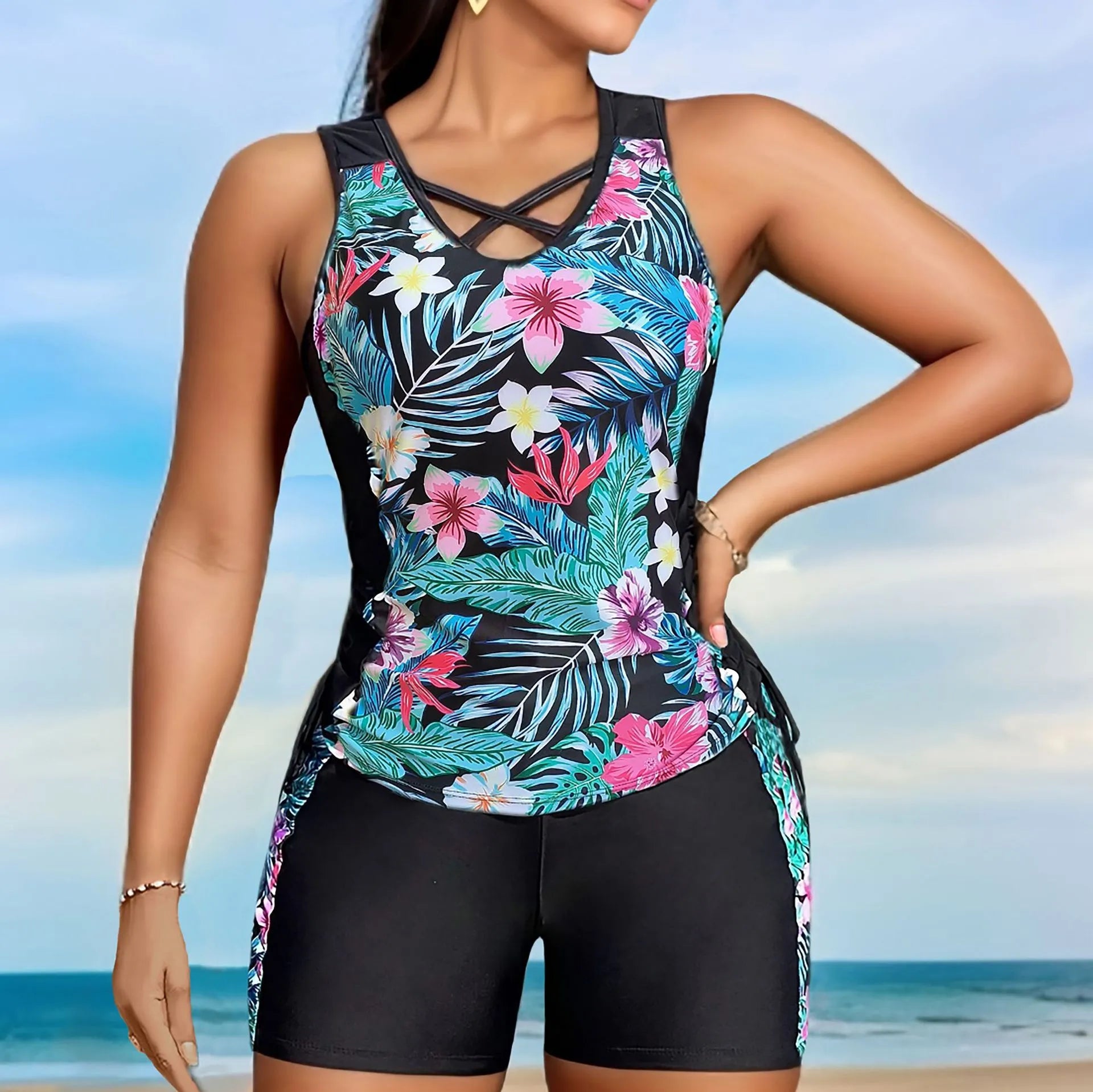 Plus size women's floral print bikini swimsuit with high waist briefs on a mannequin.